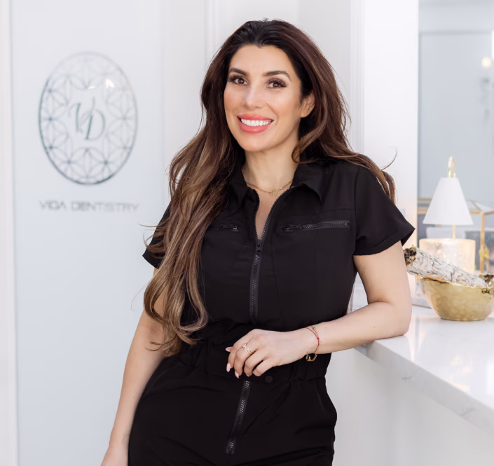 Dr. Vida at the Vida Dentistry front desk in Mission Viejo, California